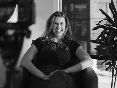 danielle allan laughing in an armchair